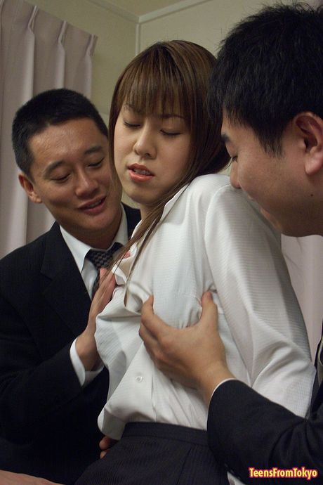 Japanese teenage girl pleasing three Asian cocks orally